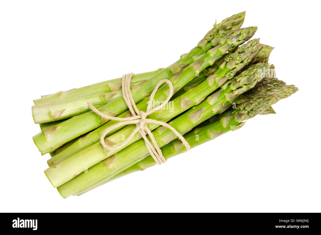 Bundle of fresh green asparagus shoots, also sparrow grass. Cultivated Asparagus officinalis. Spring vegetable with thick stems and closed buds. Stock Photo