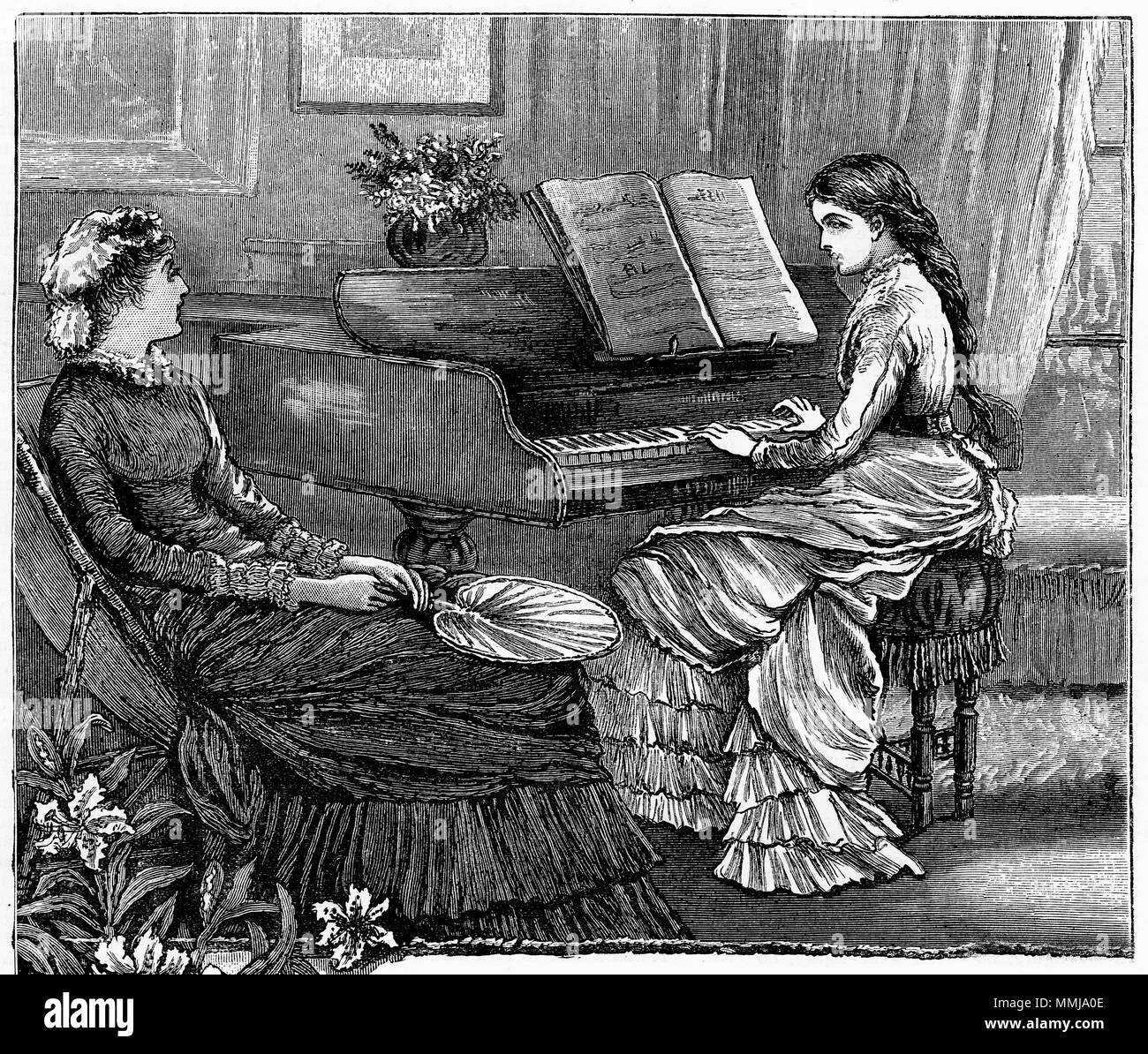 Engraving of a young woman playing a piano. From an original engraving in the Girl's Own Paper magazine 1883. Stock Photo