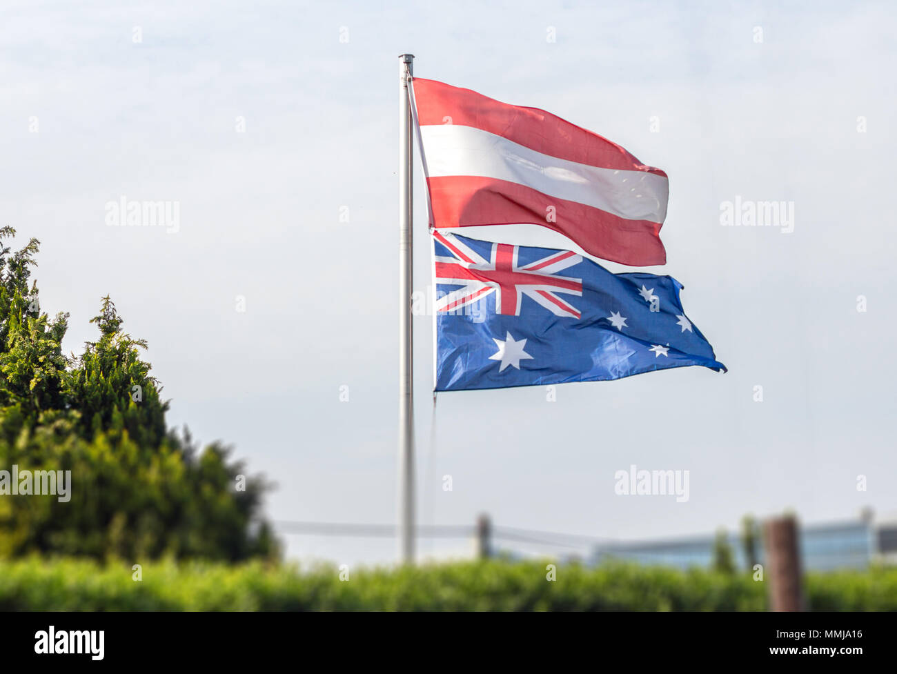 Flags of Austria and Australia on pole Stock Photo Alamy