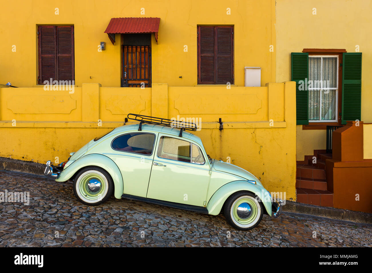 Vintage old timer parked in the malay quarter of Bo Kaap famous for its colourful architecture, Cape Town, South Africa. Stock Photo