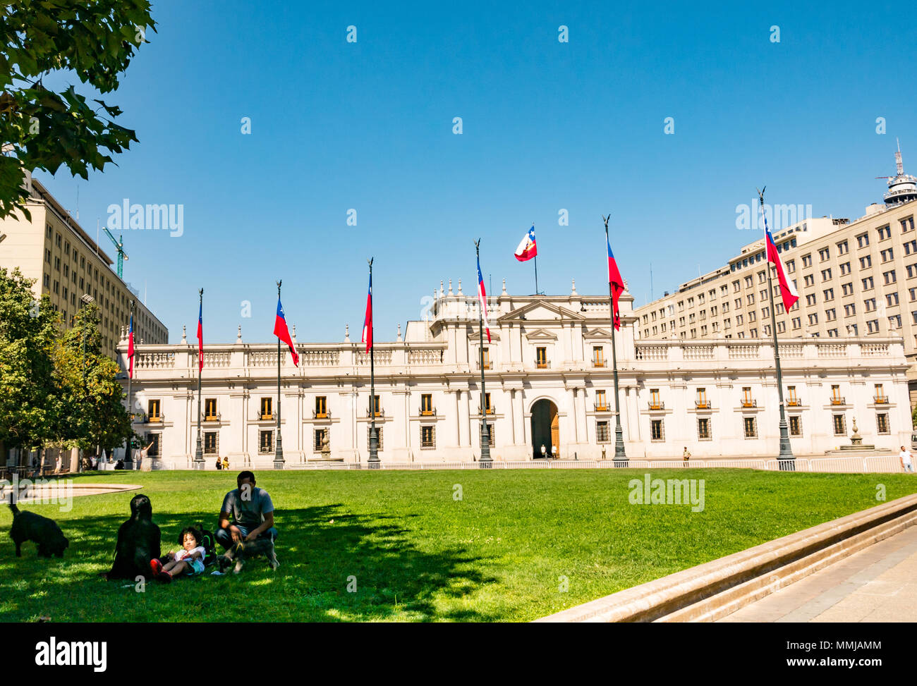 La Moneda Presidential Palace, Santiago, Chile, South America with family having picnic on grass Stock Photo