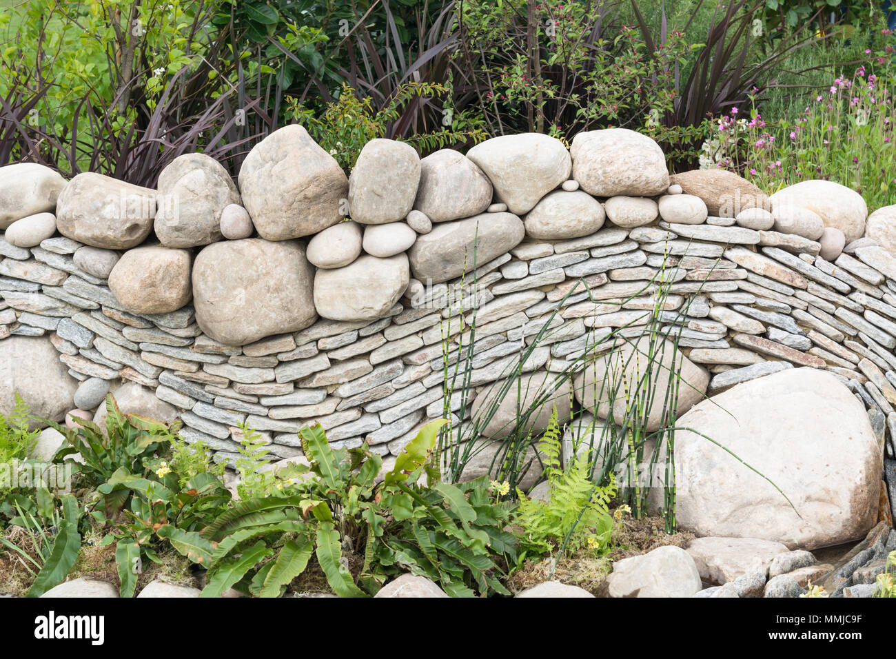 Curved dry stone wall Stock Photo - Alamy
