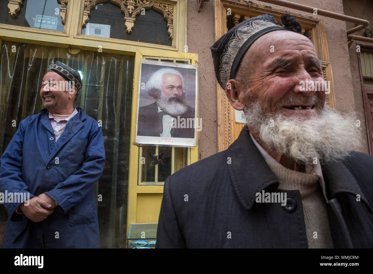 Uygur people on central street in downtown of Kashgar city, Xinjiang Uygur Autonomous Region, China Stock Photo