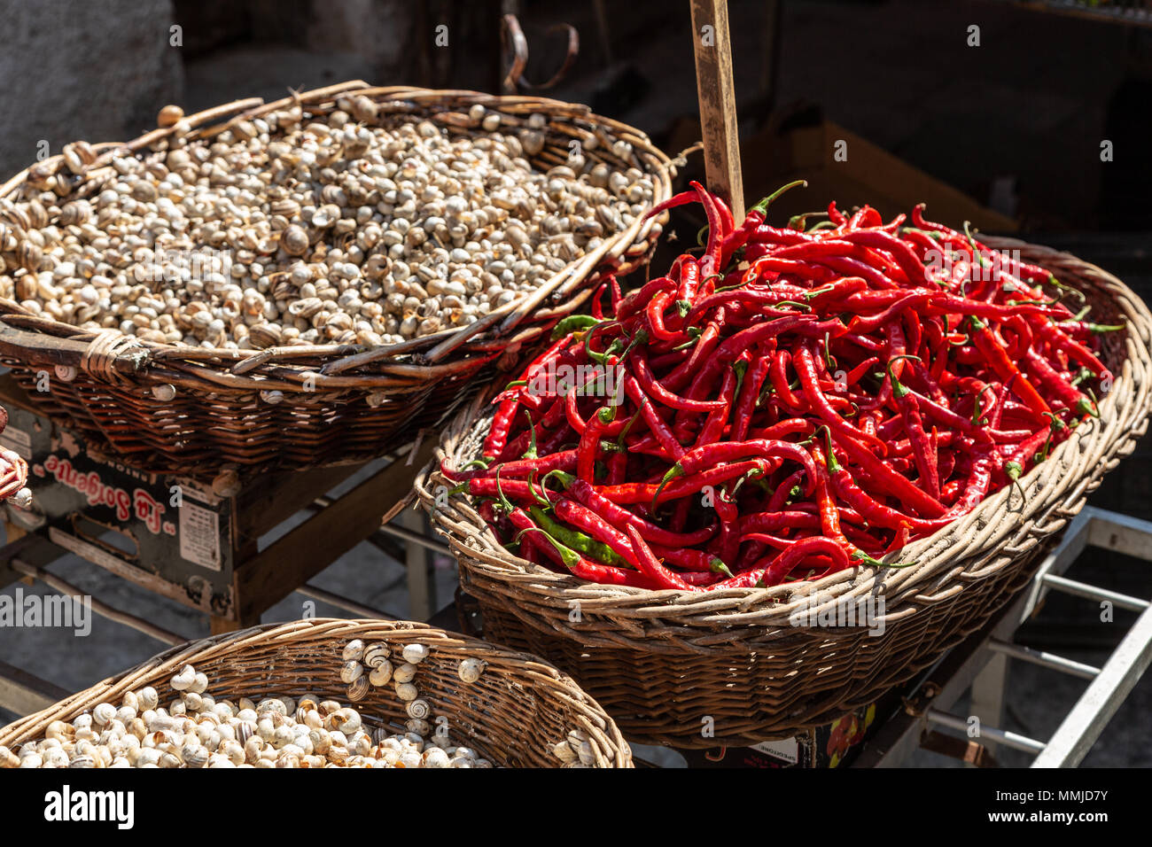 Snails and chili pepper at market stall, Palermo, Sicily Stock Photo