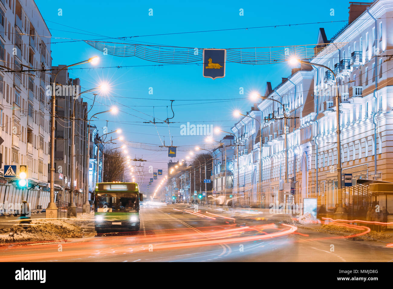 Gomel, Belarus - January 30, 2017: Morning Or Evening Traffic, Public Bus On Lenina Avenue Street At Sunrise Or Sunset Stock Photo