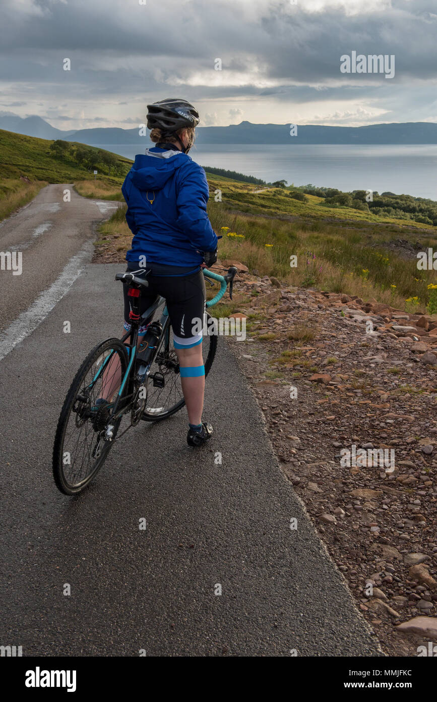 Cycling the Bealach na BÃ . Stopping on the decent to Applecross to take in the view across the Inner Sound to Skye. Stock Photo