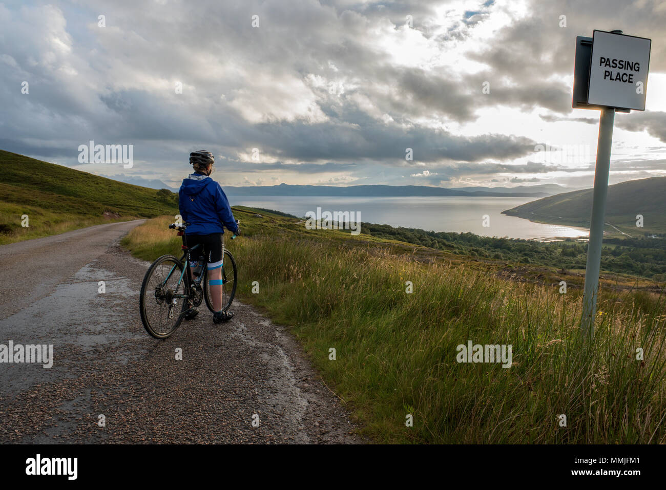 Cycling the Bealach na BÃ . Stopping on the decent to Applecross to take in the view across the Inner Sound to Skye. Stock Photo