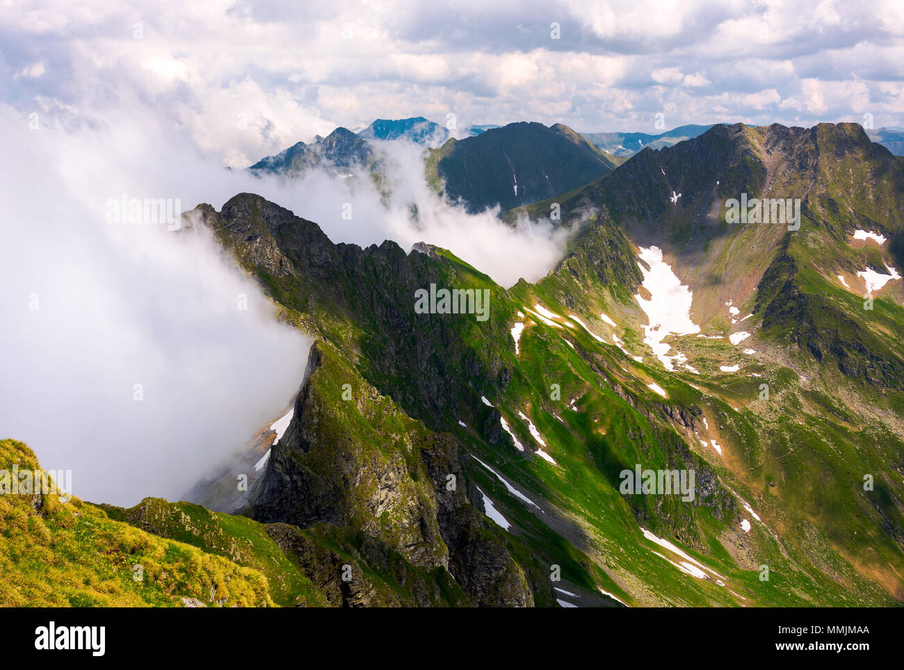 clouds rising in Fagaras mountains. beautiful summer scenery of Southern Carpathians Stock Photo