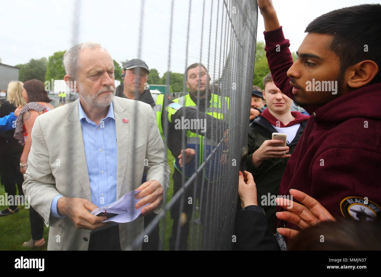 Labour leader Jeremy Corbyn speaks to TUC supporters from behind the fence during a TUC rally in central London, as part of its 'great jobs' campaign. Stock Photo
