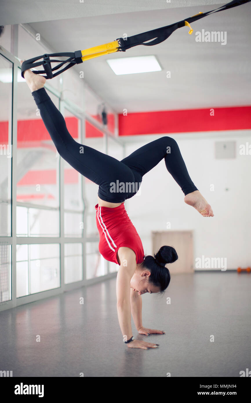 Fit Pretty Young Woman Doing Fly Yoga Stretching Exercises With Trx Fitness Straps In Fitness Training White Gym Loft Classroom Sport Healthy Lifesty Stock Photo Alamy