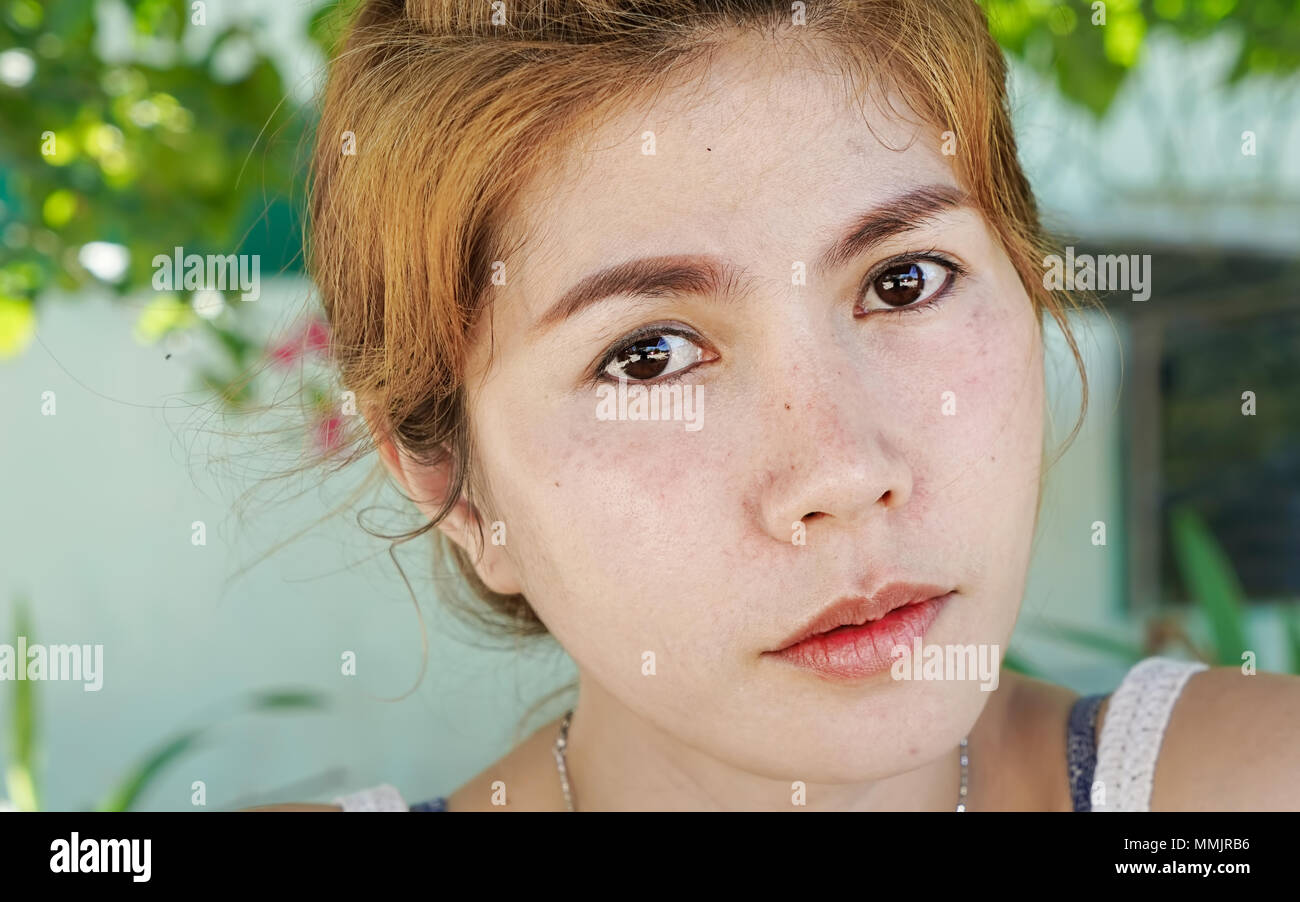 Beautiful Asian girl in background Stock Photo