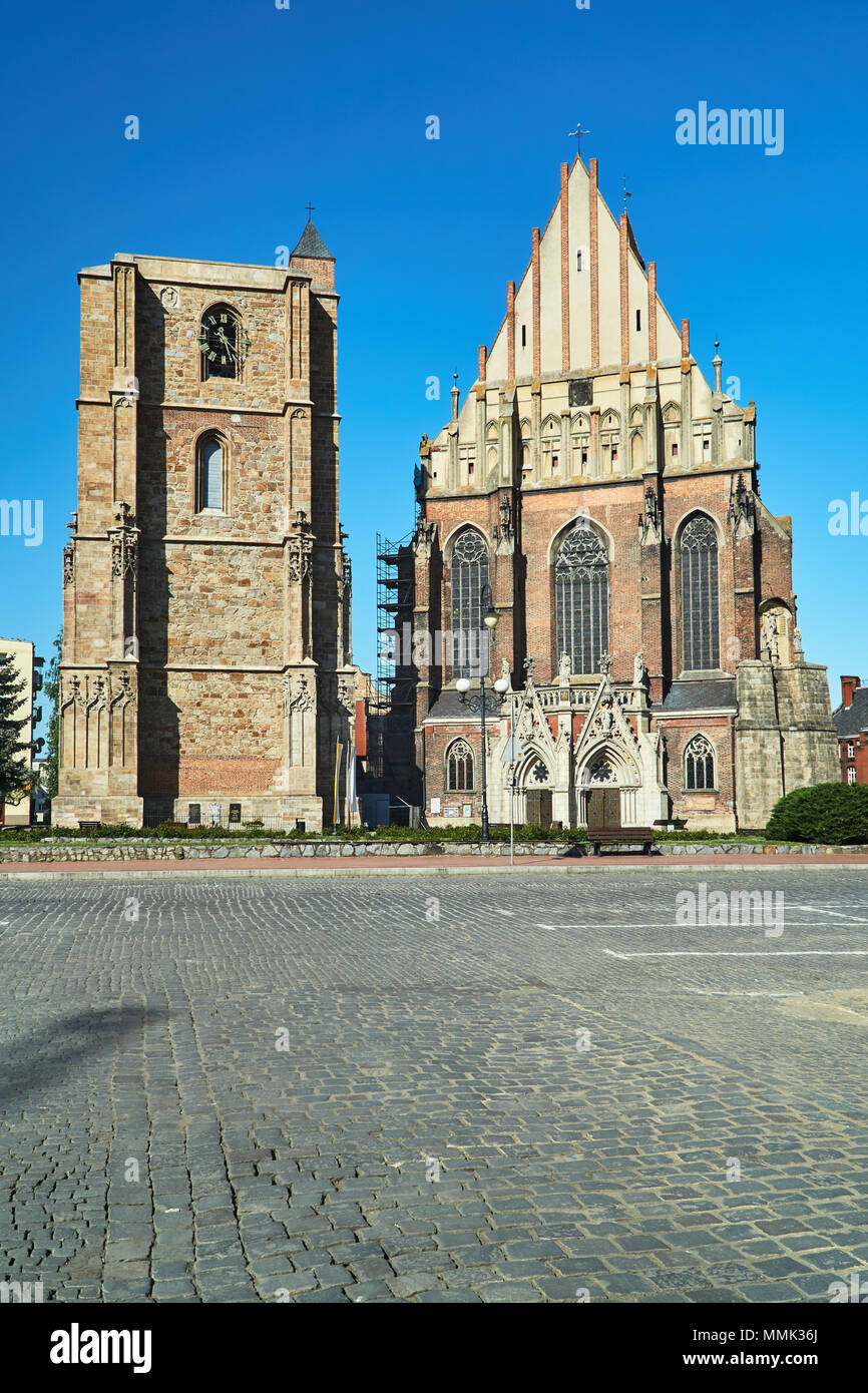 medieval campanile and facade of a Gothic church in the city of Nysa in Poland Stock Photo
