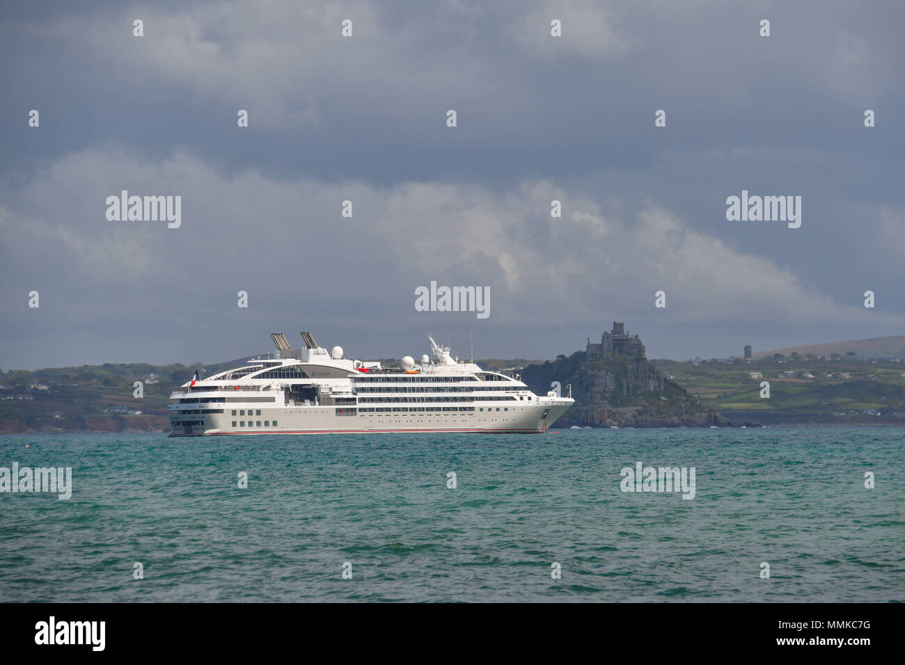 Penzance, Cornwall, UK. 12th May 2018. UK Weather. It was a mix of sunshine and showers for visitors from the French Cruise ship Le Soleal which was anchored in Mounts Bay this afternoon, near Penzance. Credit: Simon Maycock/Alamy Live News Stock Photo