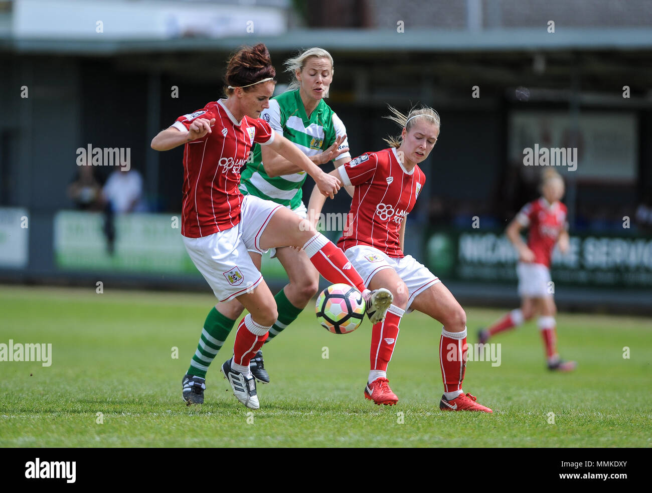 Taunton, England. 12th May 2018.  Kelly Aldridge of Yeovil competes with Jasmine Matthews and Danique Kerkdijk of Bristol during the WSL match between Yeovil Town Ladies FC and Bristol City Women FC at The Viridor Stadium. © David Partridge / Alamy Live News Stock Photo