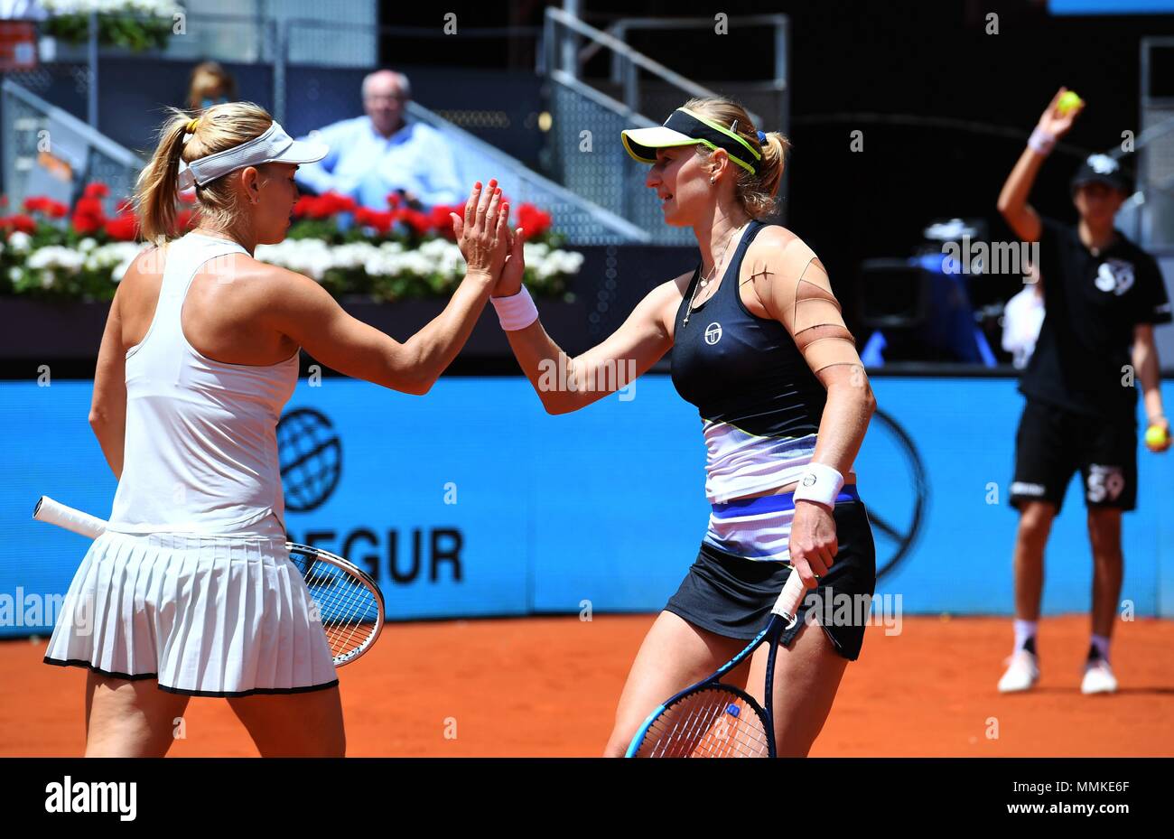 Madrid, Spain. 12th May 2018. Yekaterina Makarova (R) and Yelena Vesnina of  Russia celebrate during the women's doubles final against Kristina  Mladenovic of France and Timea Babos of Hungary at the Madrid