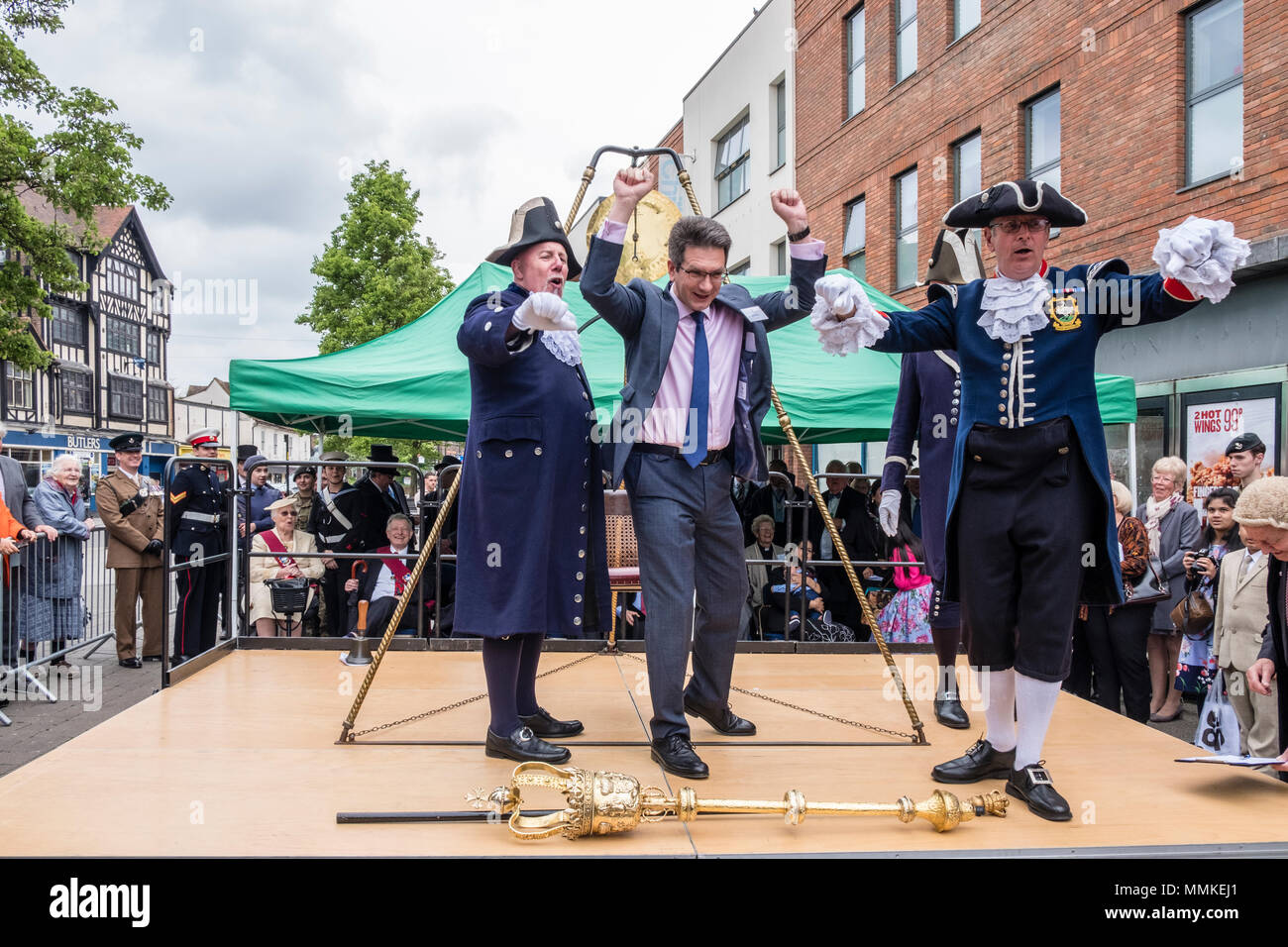 Saturday May 12th 2018. High Wycombe, Buckinghamshire, England, GB, UK. The quaint local tradition of 'Weighing in the Mayor' took place in the town centre today.  Traditionally, the outgoing and incoming mayor and civic officials are weighed at the beginning of the mayor's term of office each year to ascertain if they have gained weight at the expense of the taxpayer. The current Member of Parliament for the town, Mr Steve Baker MP, was adjudged to have gained weight and thus heartily booed by the crowd. Credit: D. Callcut/Alamy Live News Stock Photo