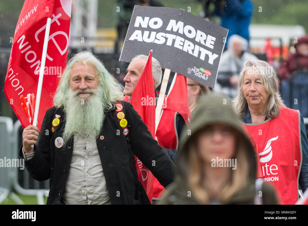 London, UK. 12th May, 2018. Despite the heavy rain, thousands turn up to hear the Labour Party leader, Jeremy Corbyn, address trade unionists during a TUC rally in Hyde Park on the theme of ‘a new deal for working people', aimed against government austerity and injustice. Credit: Guy Corbishley/Alamy Live News Stock Photo