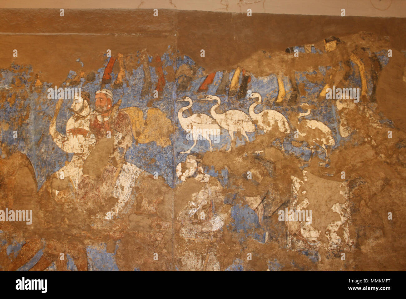 .  English: The Ambassordors' Painting, found in the hall of the ruin of an aristocratic house in Afrasiab, commissioned by the king of Samarkand, Varkhuman Description from http://www.iranicaonline.org/articles/afrasiab-ii-wall-paintings-2 :'The wall painting shows four geese and, more remarkably, an un-mounted horse, accompanied by men wearing the padām, the traditional face mask of Mazdean priests, and two men with sacrificial maces, sitting atop a camel. This scene could be interpreted as a parade of priests and sacrificial animals, which is, moreover, followed by a larger horse with a lar Stock Photo