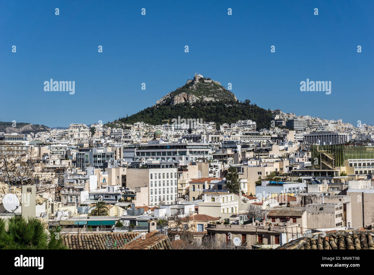 Panoramic view of Lycabettus hill (Lykavittos) in the city of Athens Greece. The hill has a large open-air amphitheater at the top Stock Photo