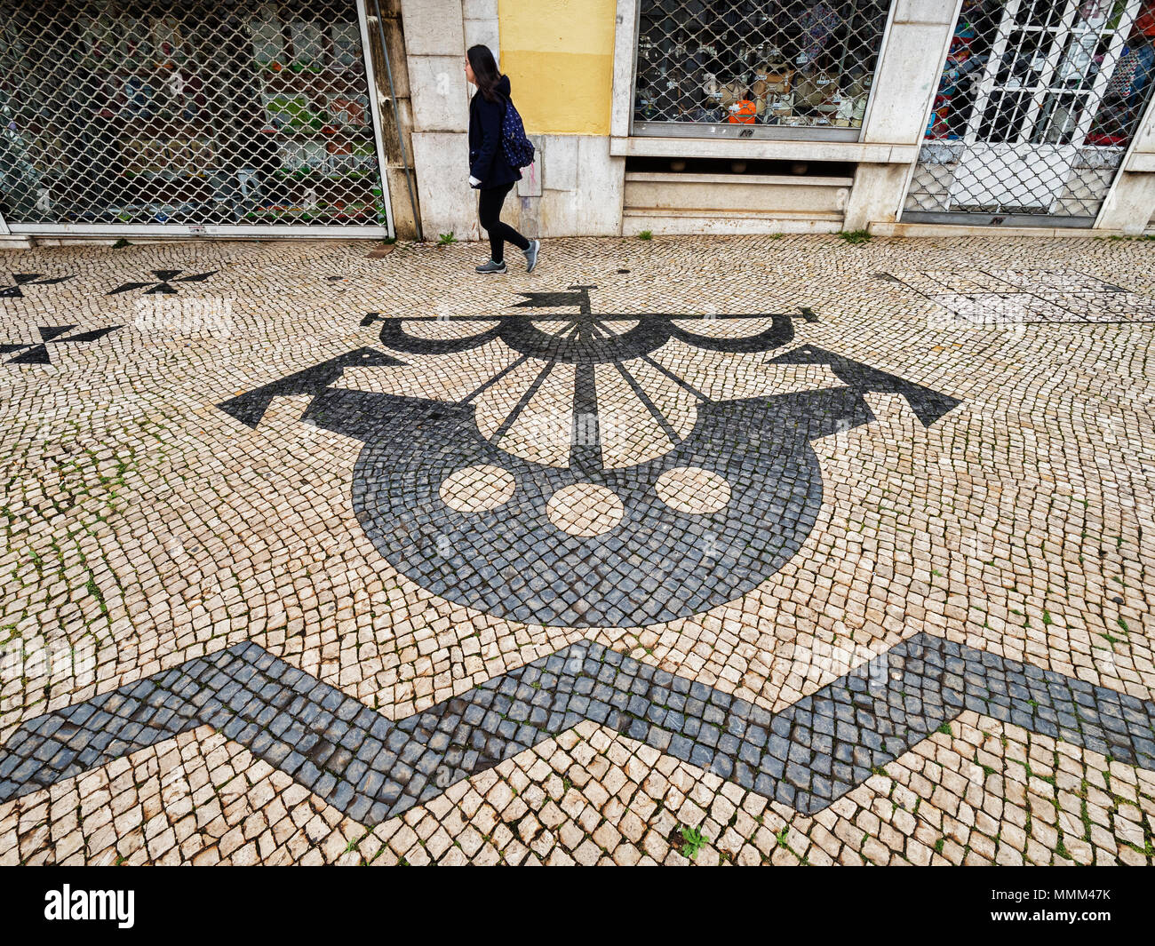 27 February 2018: Lisbon, Portugal - Traditional Portuguese Pavement, or calcada portuguese, the tiled pavement found in public areas of Portugal, her Stock Photo