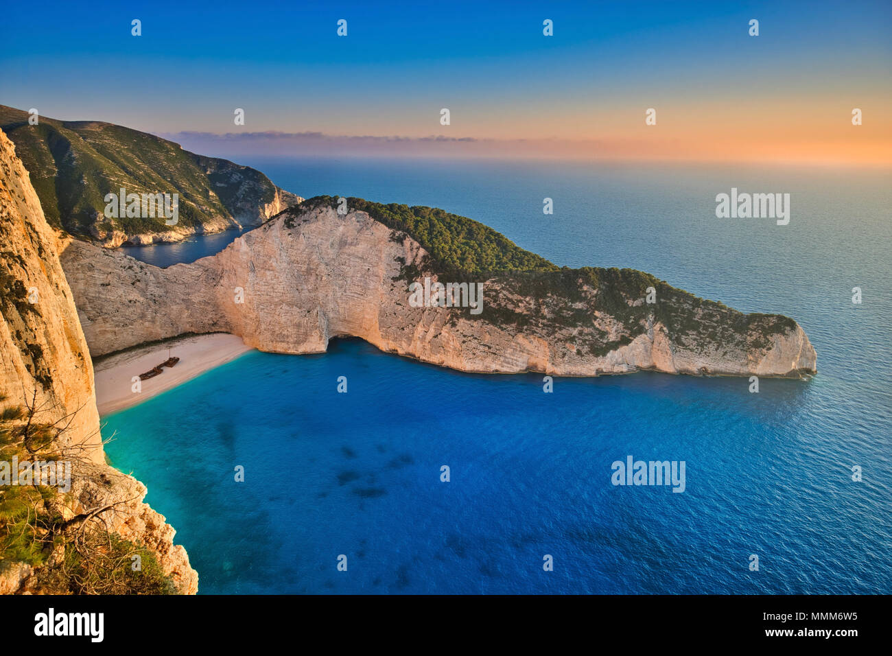 Photo if the sunset at the greece beach of navagio Stock Photo
