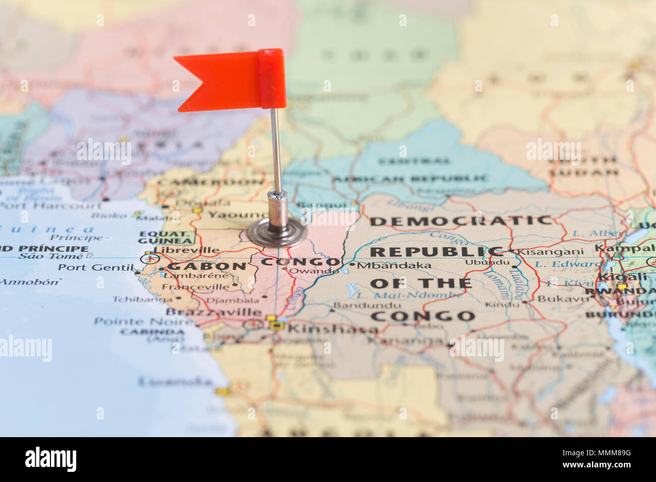 Small red flag marking the African country of Congo on a world map ...