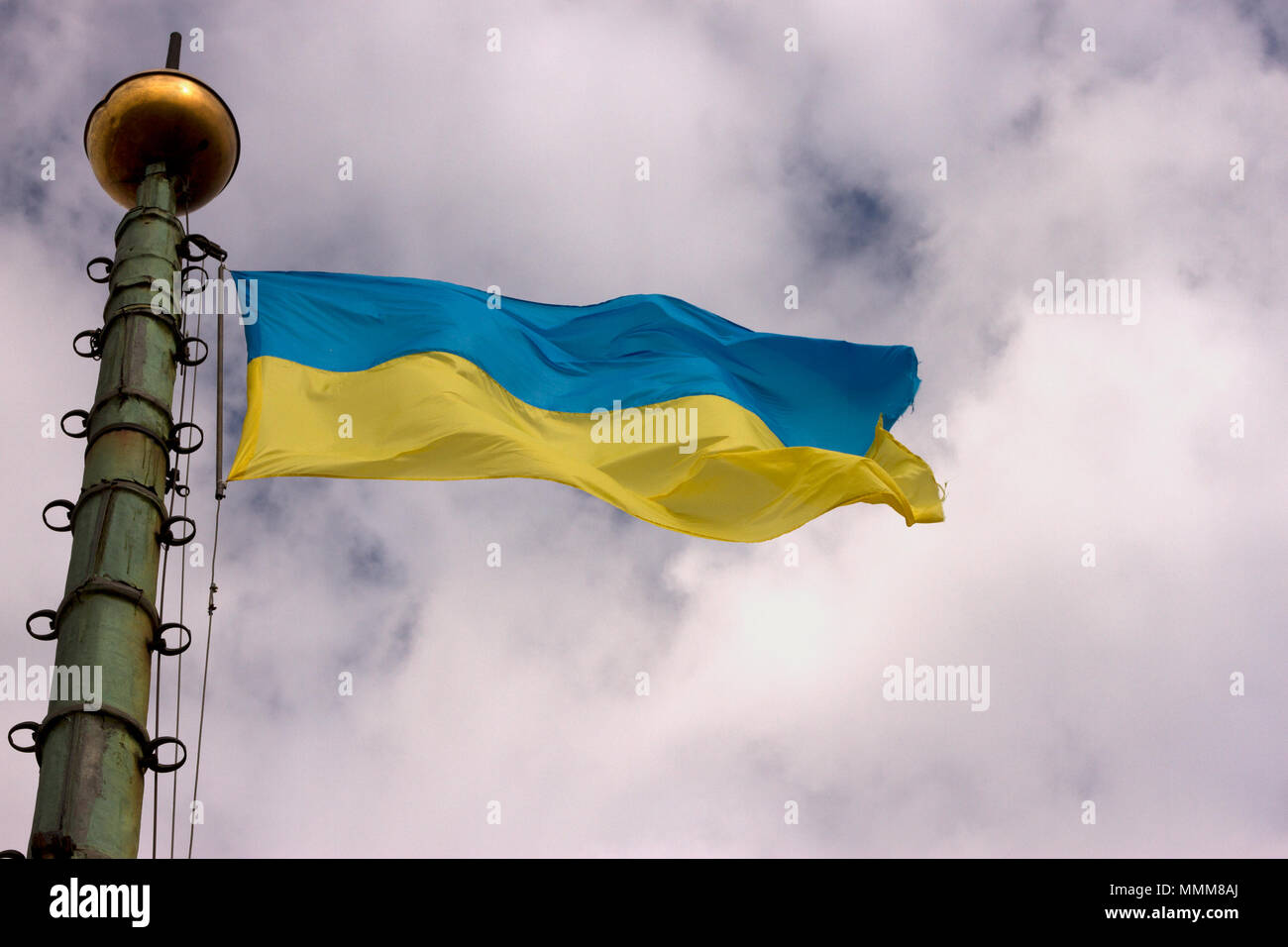 Flag of Ukraine is developing in the sky Stock Photo