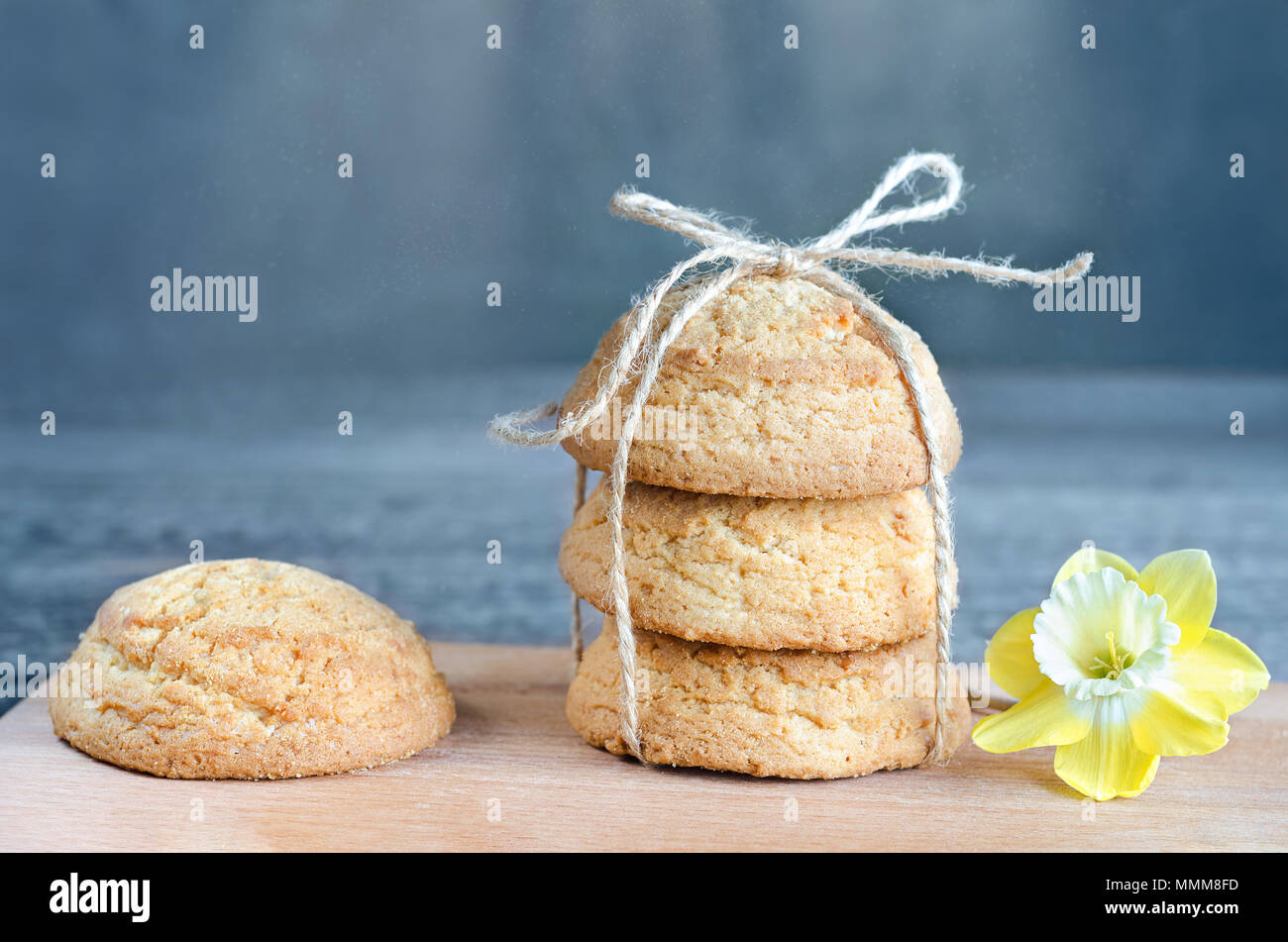 Cookies tied with a rope on a gray-blue background. Selective focus Stock Photo