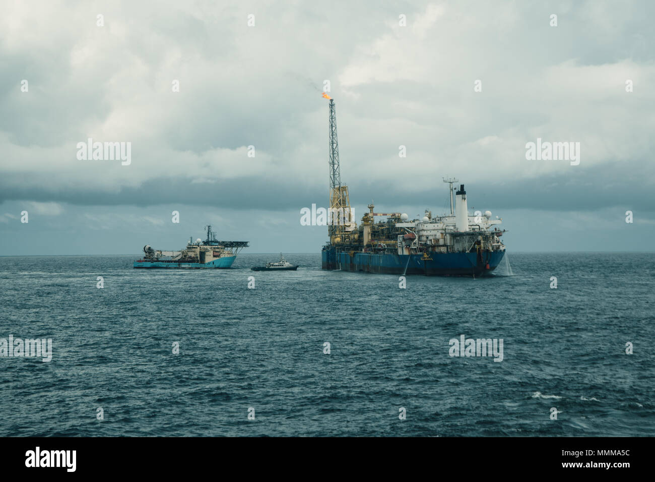 DP operations near FPSO tanker. Supply fleet job, DSV diving support vessel is approaching