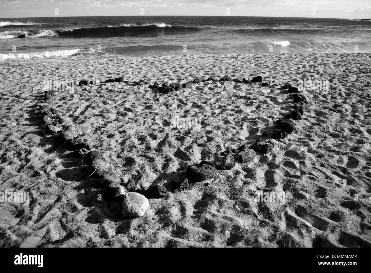A heart shaped with rocks on the sands of Shipwreck Beach, Poipu, Kauai, Hawaii, USA Stock Photo