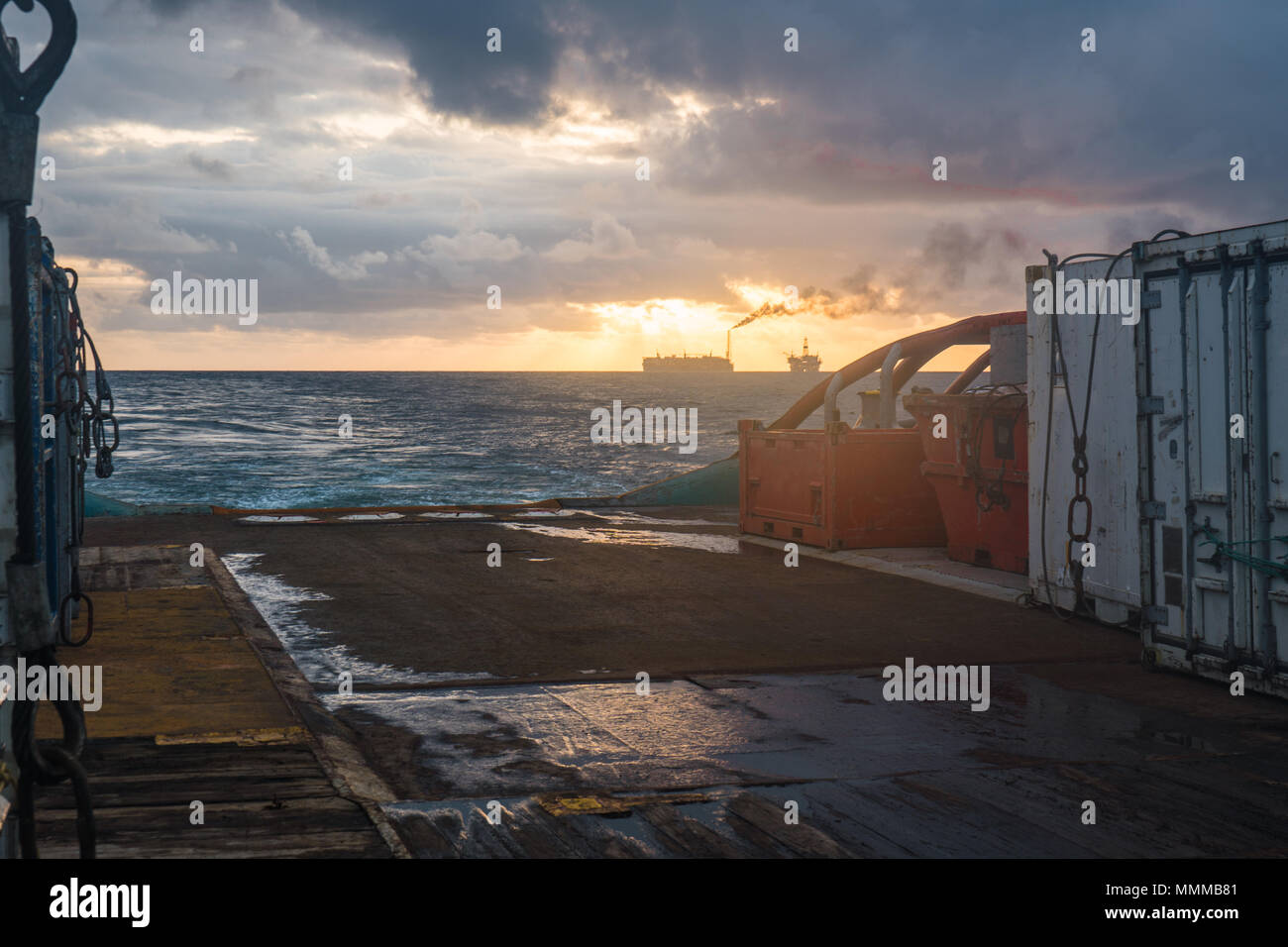 offshore supply boat with ccontainers and tanks onboard delivers cargo