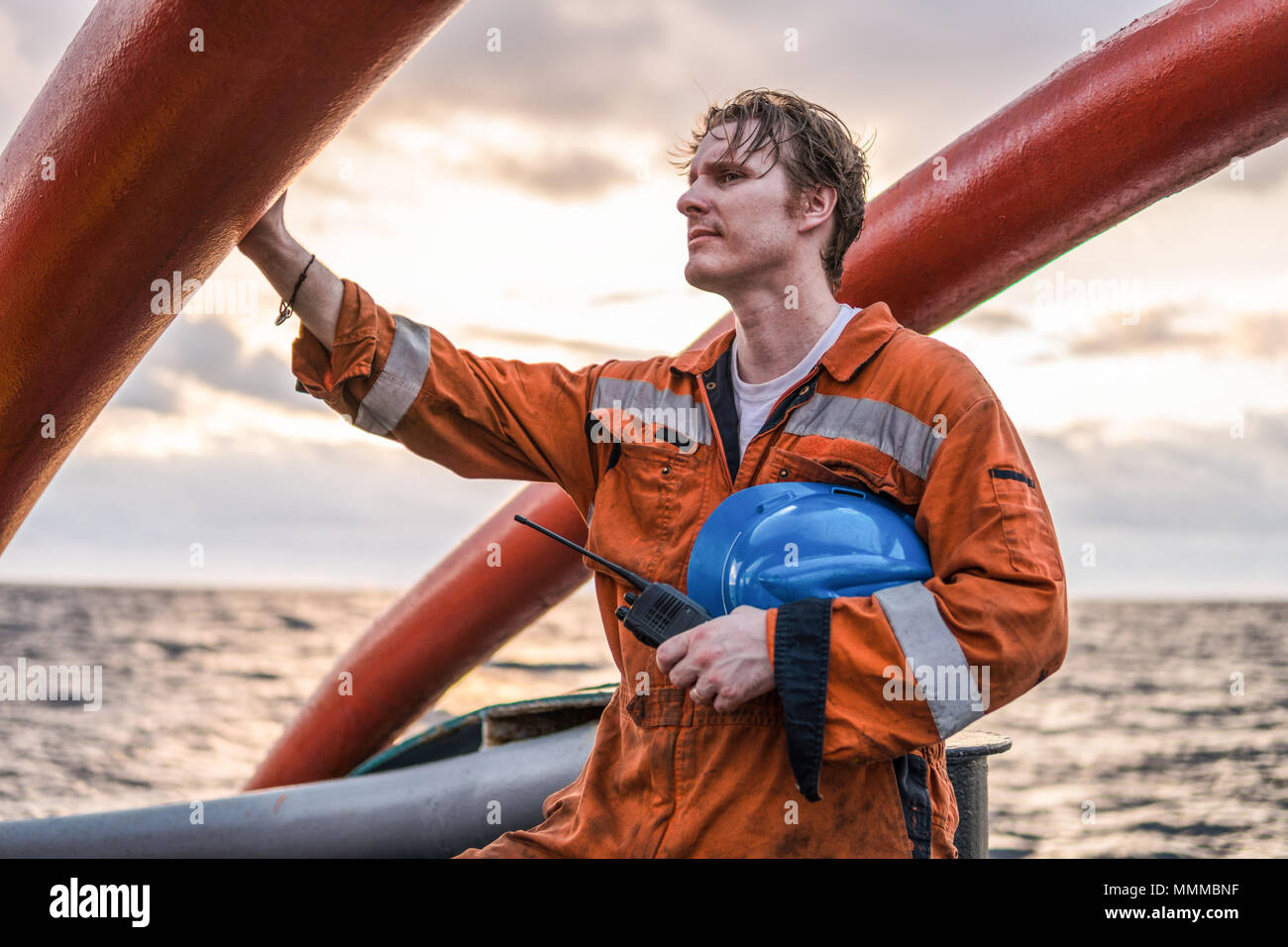 Deck Officer on deck of offshore vessel or ship , wearing PPE personal