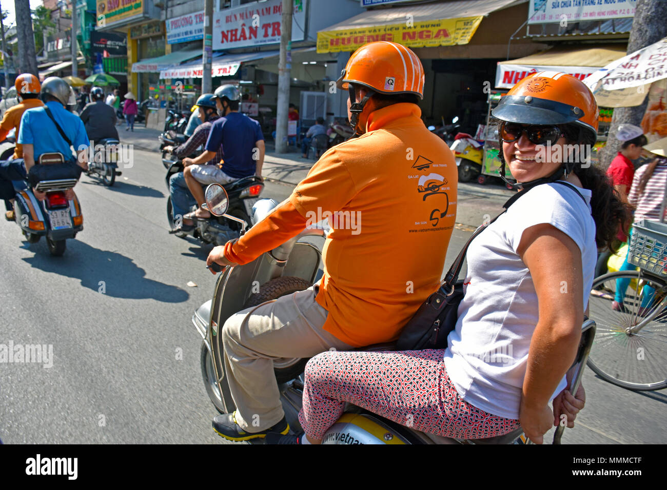 Vietnamese woman riding motorcycle hi-res stock photography and images ...