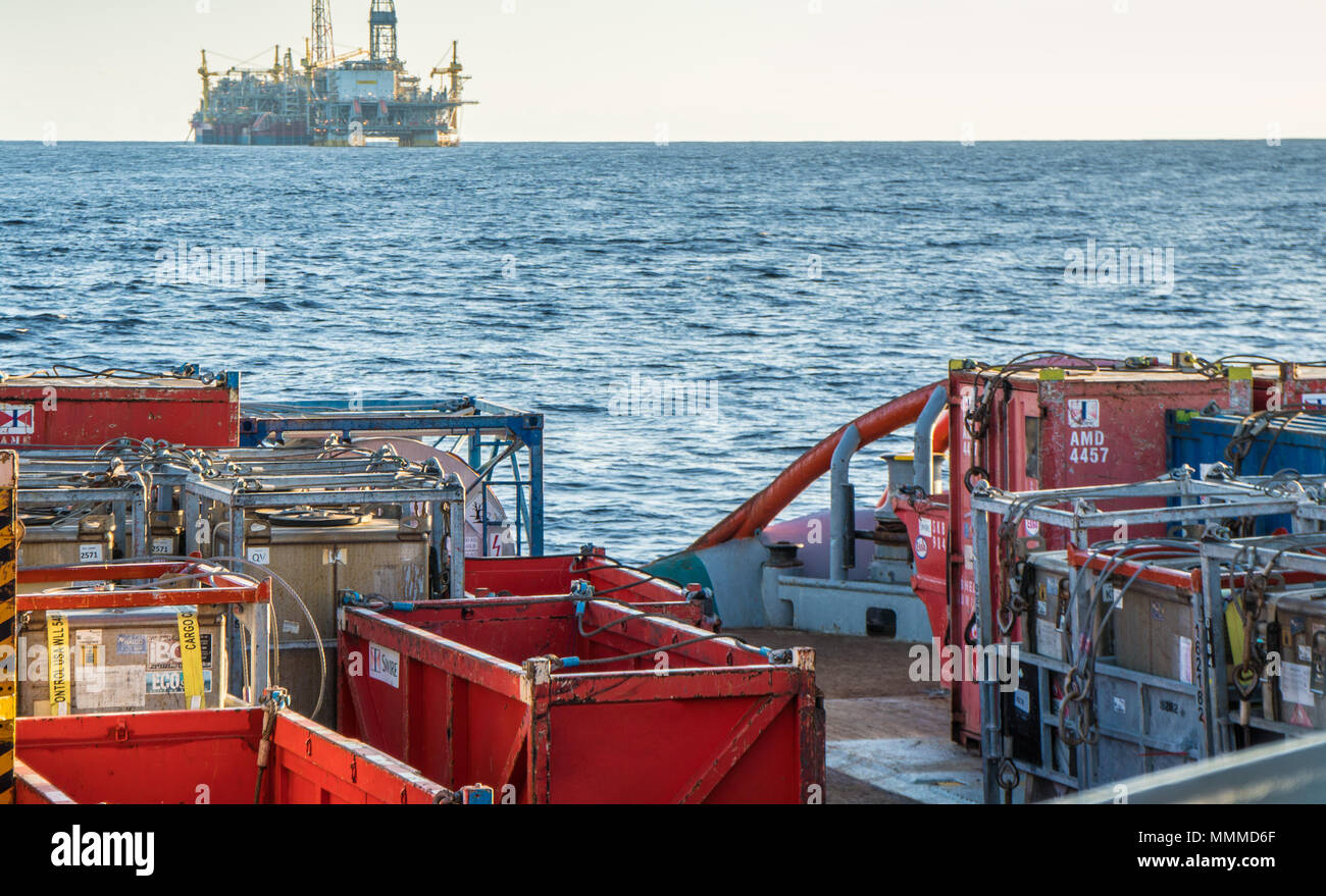 offshore supply boat with containers and tanks onboard delivers cargo