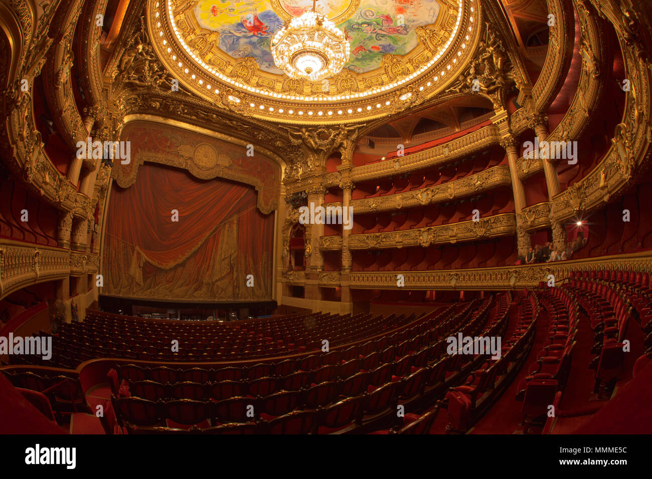 Paris, France - October, 2017: Auditorium inside of the Palais Garnier Opera Garnier in Paris, France. The seven-ton bronze and crystal chandelier was designed by Garnier. Stock Photo