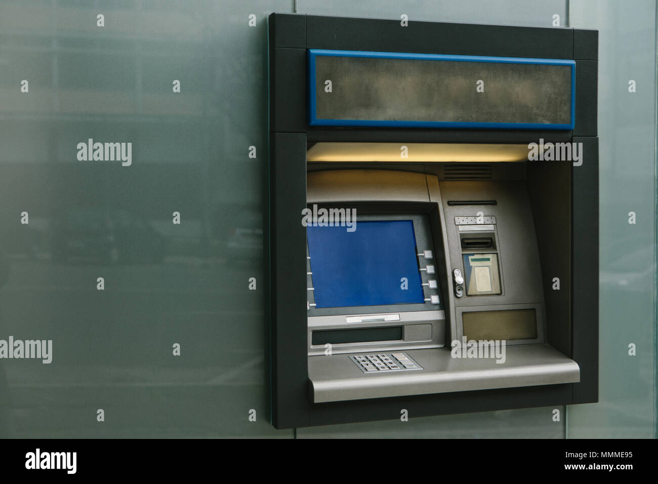 Modern street ATM machine for withdrawal of money and other financial transactions Stock Photo