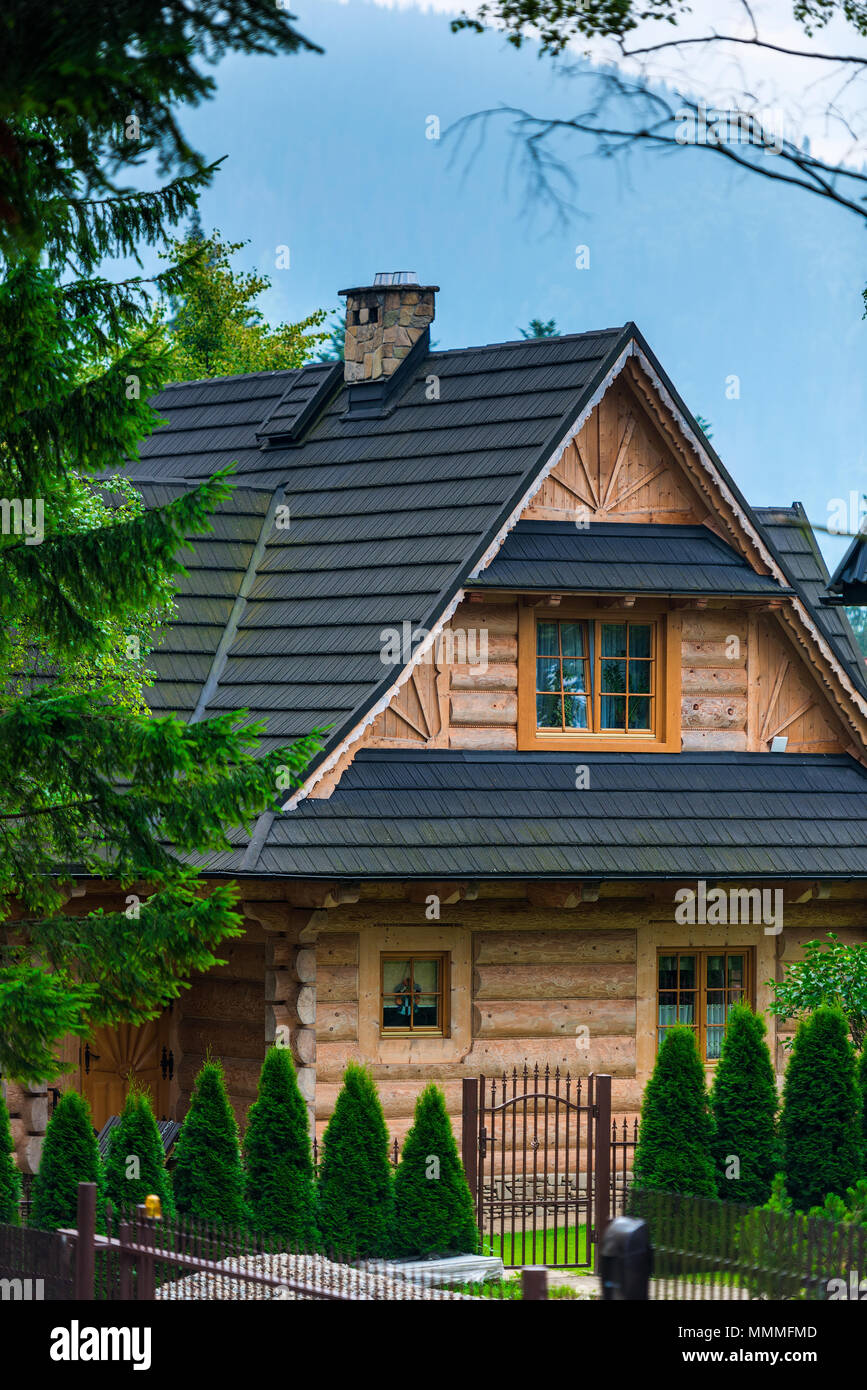 log house with a beautiful courtyard in European style Stock Photo