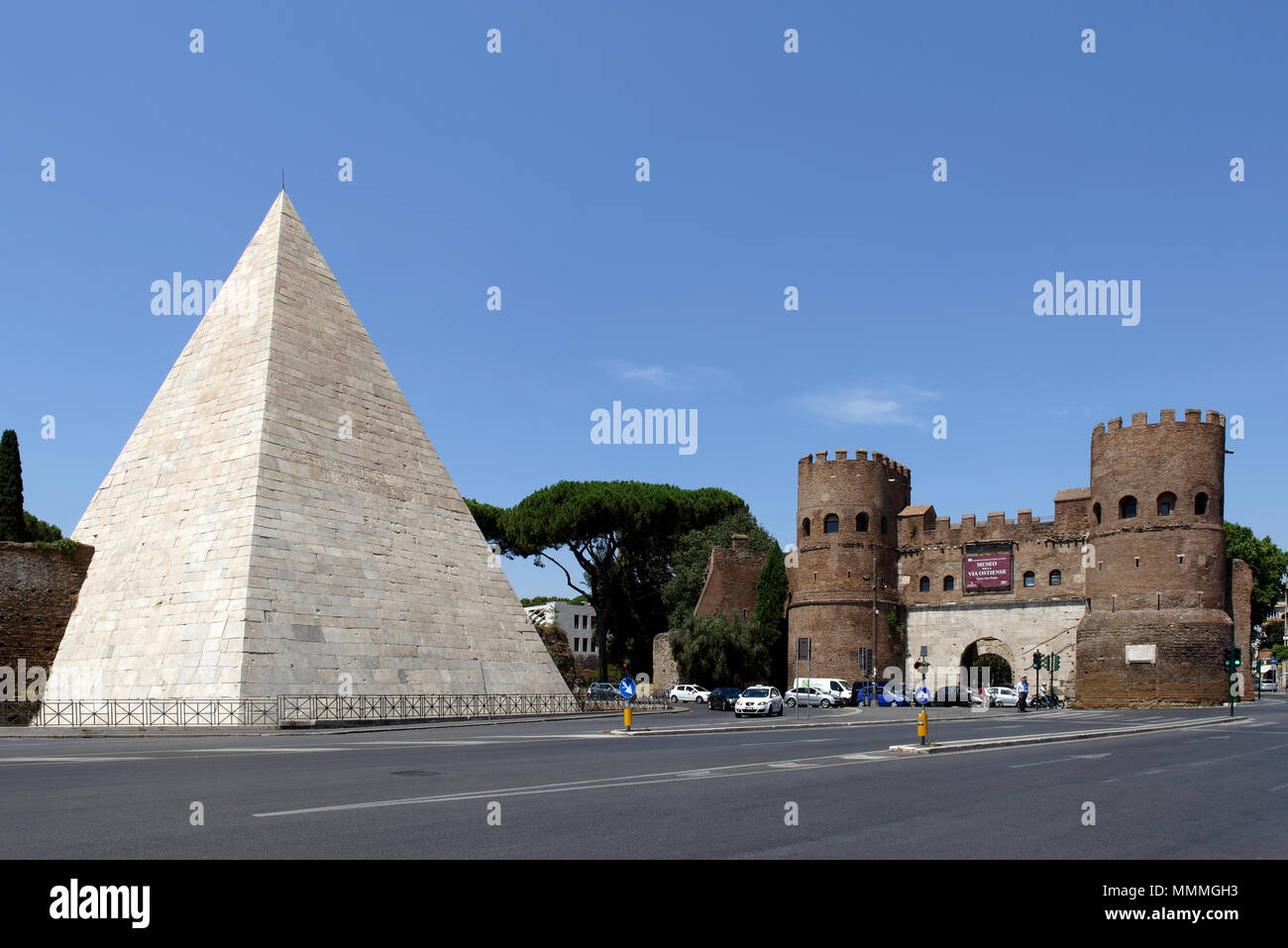 The Pyramid of Caius Cestius and the twin towered Porta San Paolo in the Rome neighbourhood of Testaccio. The Pyramid (Piramide di Caio Cestio) was bu Stock Photo