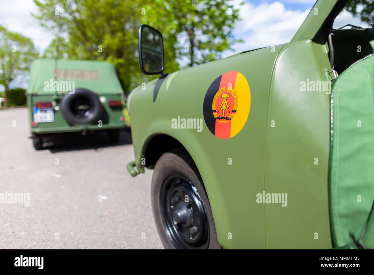 An oldtimer car with a ddr sign stands on a street Stock Photo
