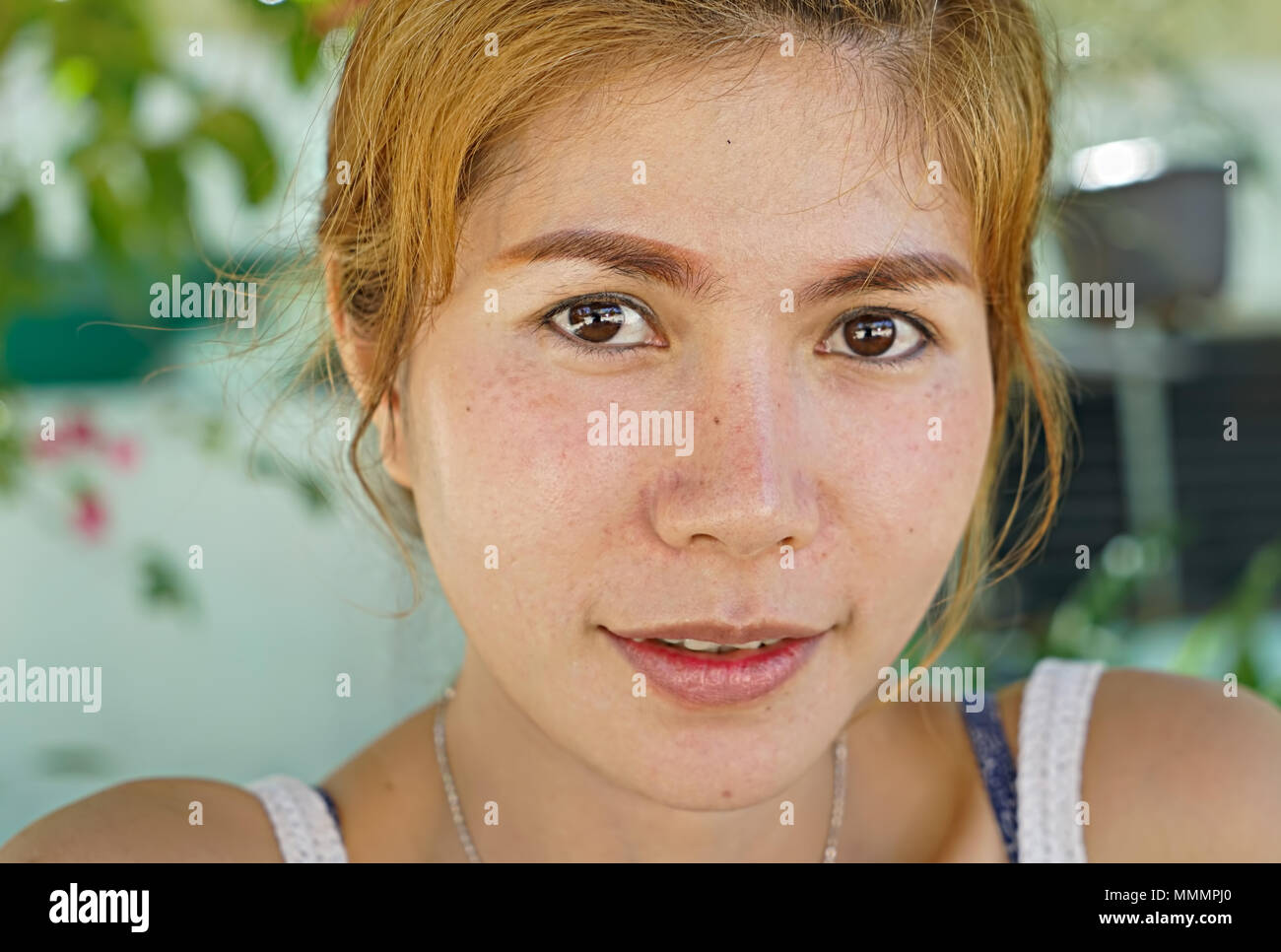 Beautiful Asian girl in background Stock Photo