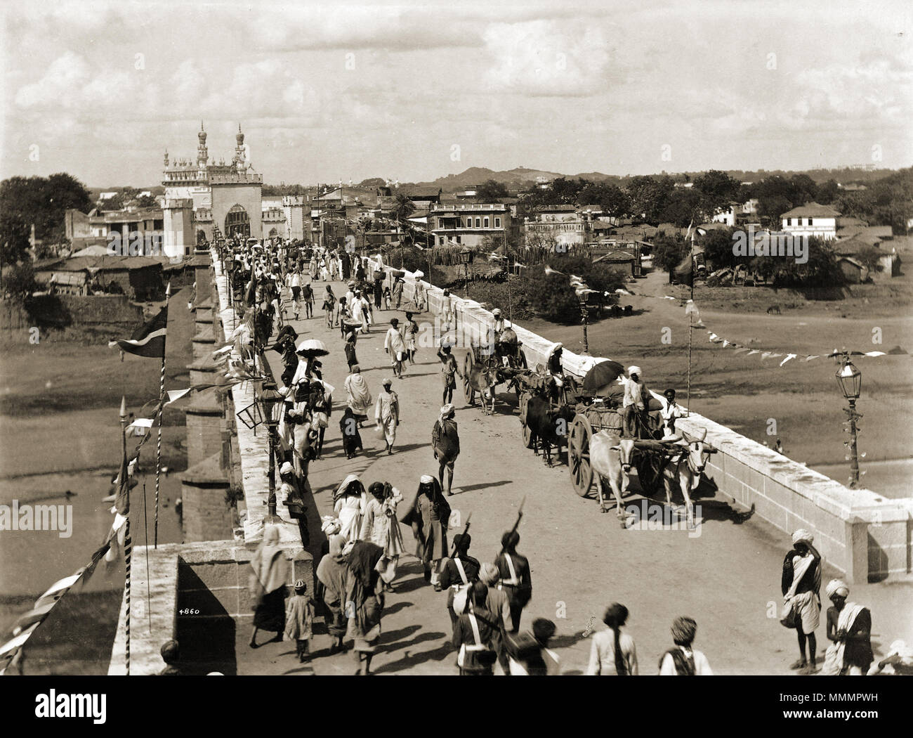 . Photograph of the entrance bridge to the city of Hyderabad, Andhra Pradesh, from the Curzon Collection: 'Views of HH the Nizam's Dominions, Hyderabad, Deccan, 1892'.  . 1880s.   Lala Deen Dayal  (1844–1905)     Alternative names Raja Deen Dayal  Description Indian photographer  Date of birth/death 1844 5 July 1905  Location of birth/death Sardhana Mumbai  Authority control  : Q1182338 VIAF:?94369161 ISNI:?0000 0000 8166 9953 ULAN:?500037191 LCCN:?n79141503 GND:?129514721 WorldCat Entrance bridge to Hyderabad, India Stock Photo