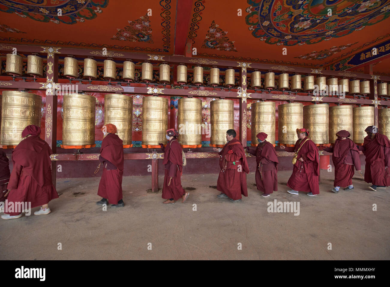 Tibetan monks and nuns spinning prayer wheels, Yarchen Gar, Sichuan