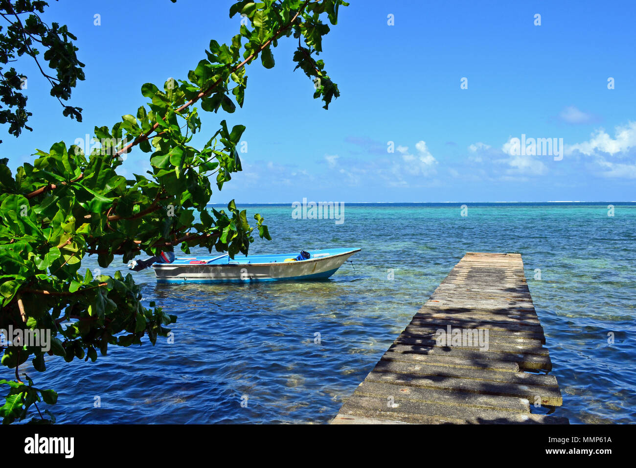 Boat close to a pier in a tropical island, Mwand Pass, Pohnpei, Federated States of Micronesia Stock Photo