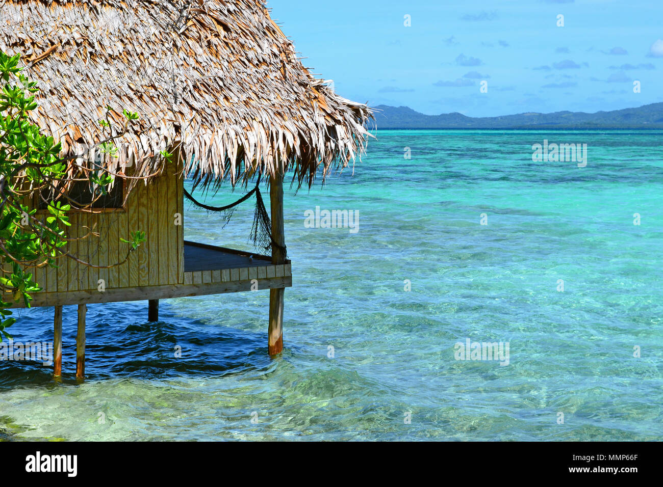 A beach bungalow in  a tropical paradise, Black Coral Island, Pohnpei, Federated States of Micronesia Stock Photo