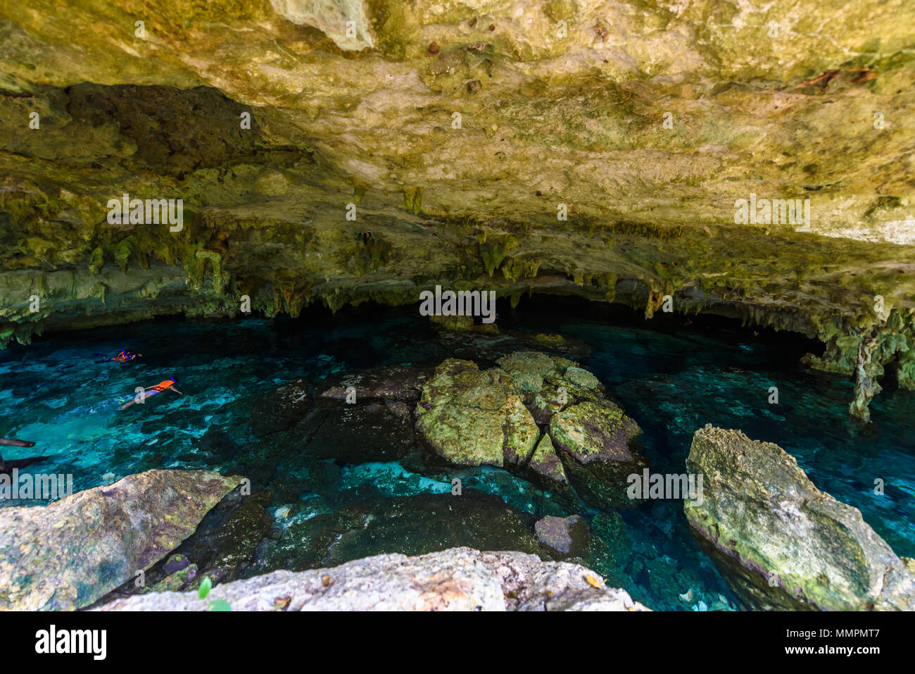 Cenote Dos Ojos in Quintana Roo, Mexico. People swimming and snorkeling
