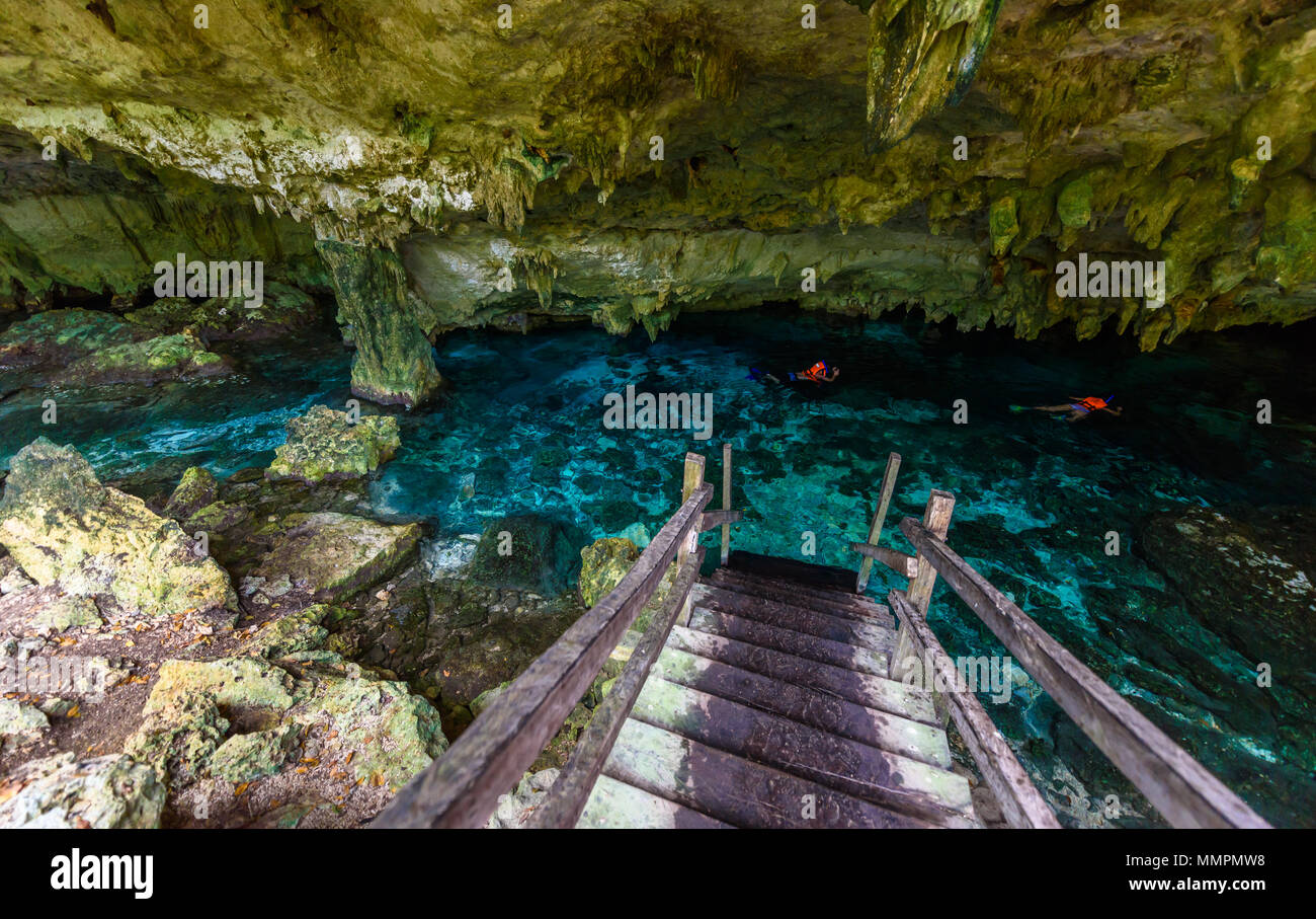 Cenote Dos Ojos in Quintana Roo, Mexico. People swimming and snorkeling