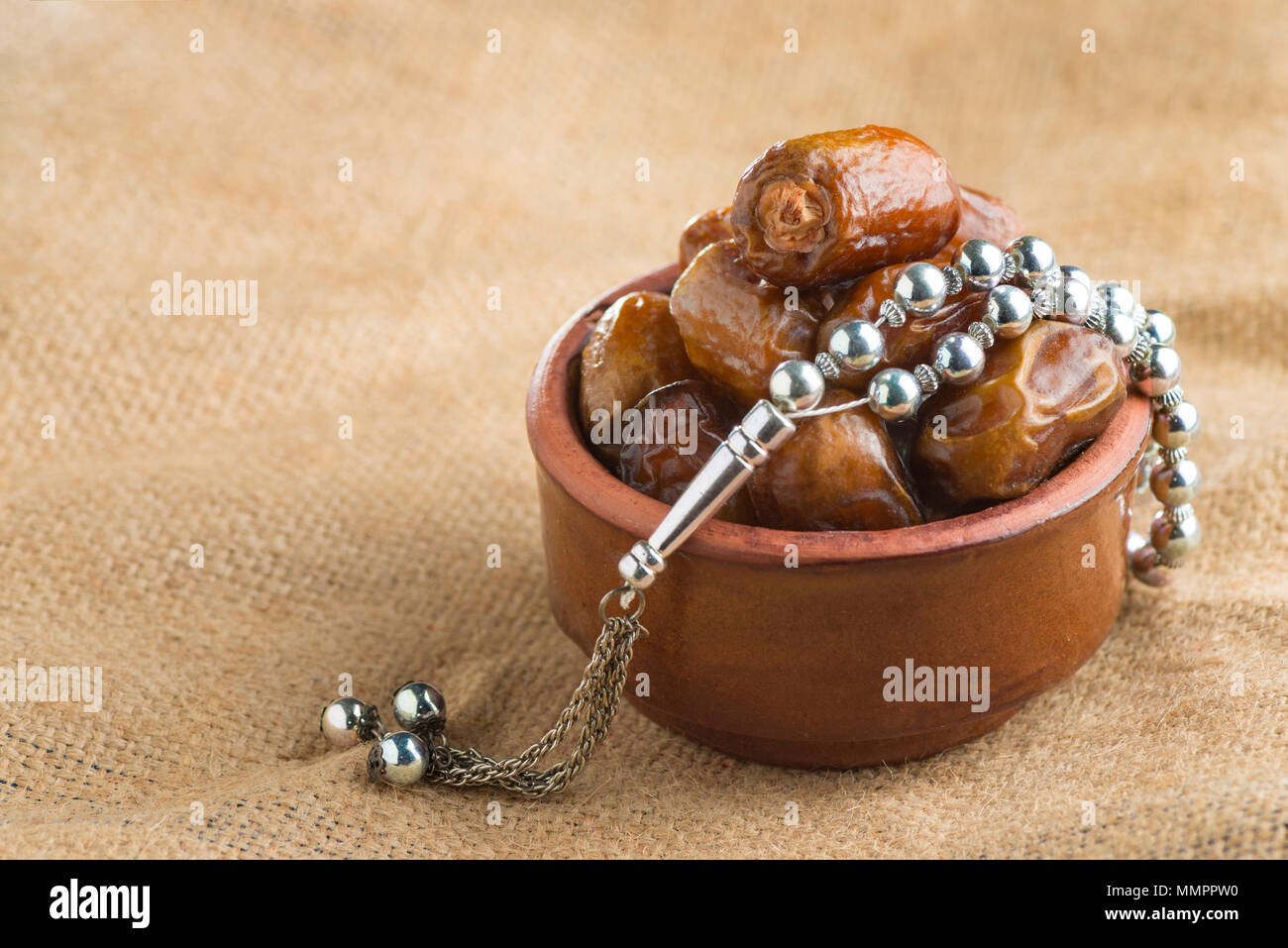 Arabian Ramadan Dried Dates and Rosary on Vintage Background Stock Photo