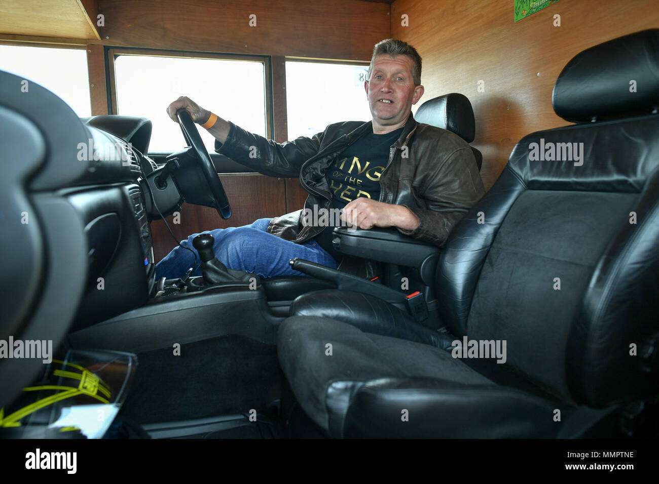 Kevin Nicks, the driver of the Fastest Shed which broke the 100mph mark, sits in the vehicle after his run in the annual UK, European and World land speed event organised by Straightliners, at Pendine Sands, Wales, where riders and drivers of all vehicle types compete in classes for top speeds over a measured mile on the beach. Stock Photo