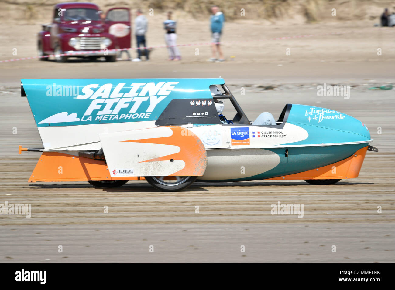 An electric side-car vehicle takes part in the annual UK, European and World land speed event organised by Straightliners, at Pendine Sands, Wales, where riders and drivers of all vehicle types compete in classes for top speeds over a measured mile on the beach. Stock Photo