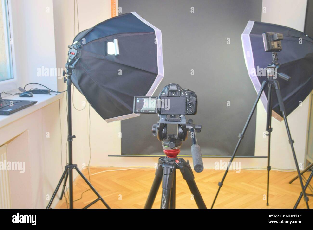 Empty photo studio with lighting equipment. Professional camera with  picture of photo studio Stock Photo - Alamy